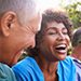 man and woman outdoors while laughing