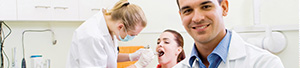 teenage girl with dental hygienist and dentist